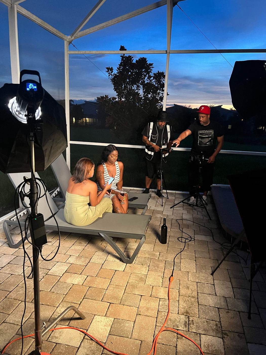 O.U.C. Films crew lighting and filming an on-location scene